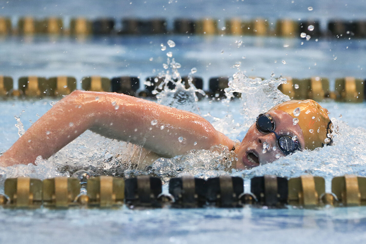 Makenna Lambert takes a breath during the final leg of her 200 yard IM